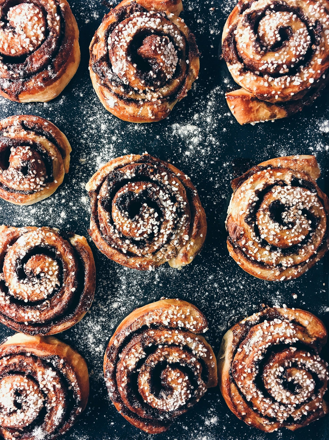Fresh baked cinnamon buns dusted with sugar